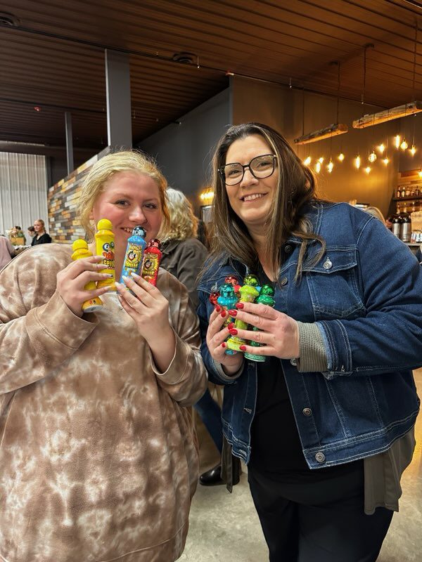Bingo guests show off their daubers.